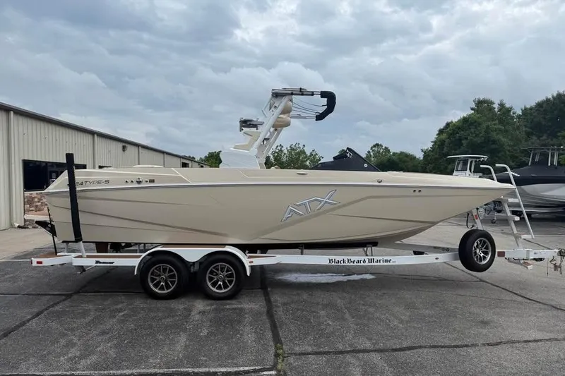 The Image of 2024 ATX Surf Boats 24 Type-S on trailer, parked outdoors. - 0