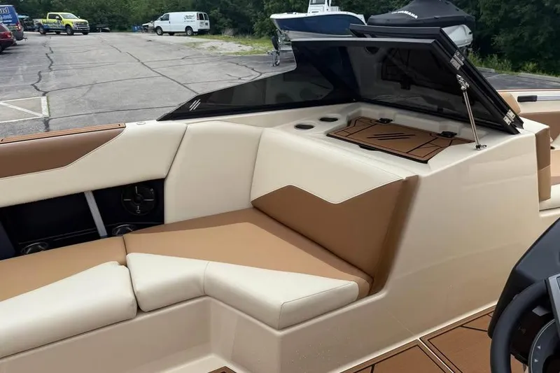 Slide: The Image of 2024 ATX Surf Boats 24 Type-S interior with tan and cream seating. - 10