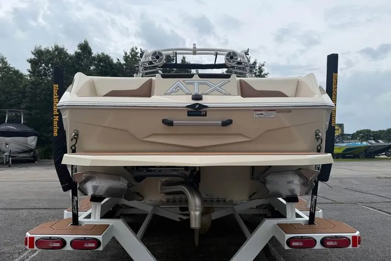 Slide: The Image of 2024 ATX Surf Boats 24 Type-S rear view on trailer, showcasing sleek design. - 4