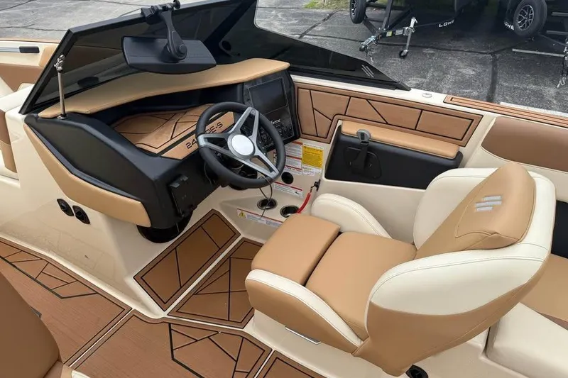 Slide: The Image of 2024 ATX Surf Boats 24 Type-S interior with tan and cream seating, modern dashboard. - 8