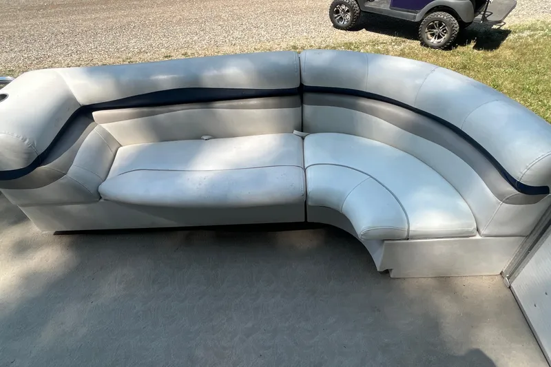 Slide: The Image of 2007 Harris-Kayot Super Sunliner 220 O/B boat seating, white and blue, outdoor setting. - 9