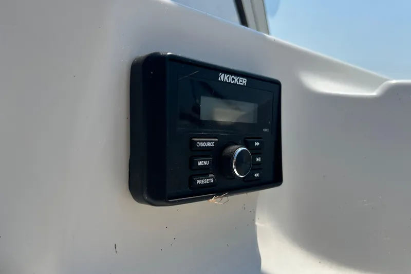 Slide: The Image of Kicker audio system on 2003 Regal Commodore 2860 boat dashboard. - 12
