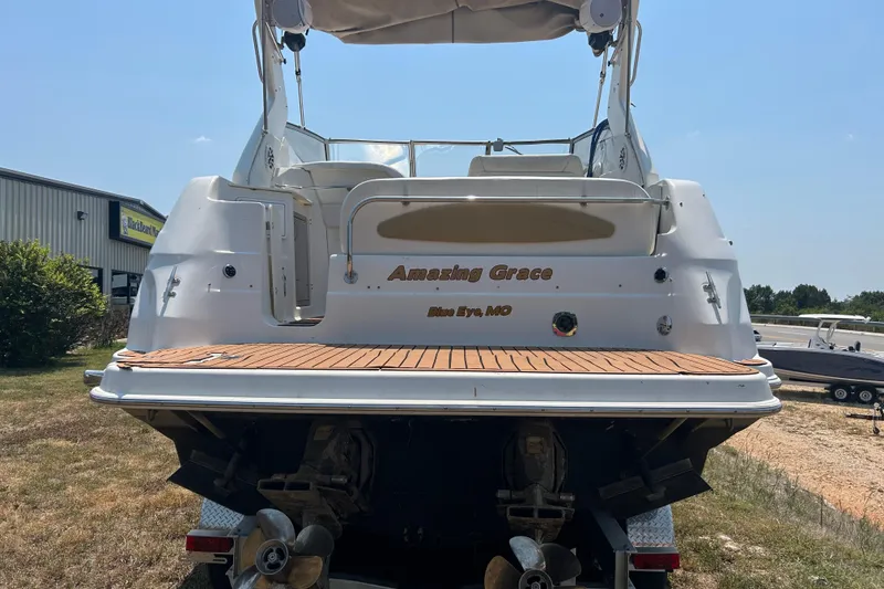 Slide: The Image of 2003 Regal Commodore 2860 boat named "Amazing Grace" docked outdoors. - 3