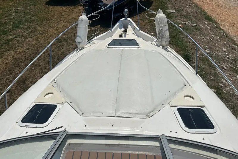 Slide: The Image of 2003 Regal Commodore 2860 boat deck with railing and hatches. - 5