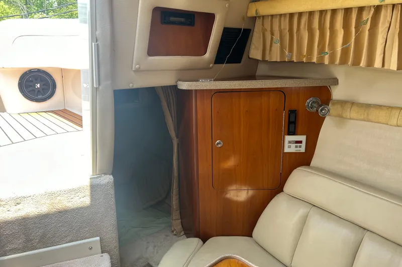 Slide: The Image of Interior of 2003 Regal Commodore 2860 boat with wood cabinet and seating. - 7