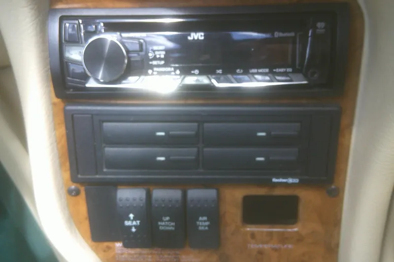 Slide: The Image of Dashboard controls of a 1997 Mariah Z 210 Shabah with JVC stereo system. - 12