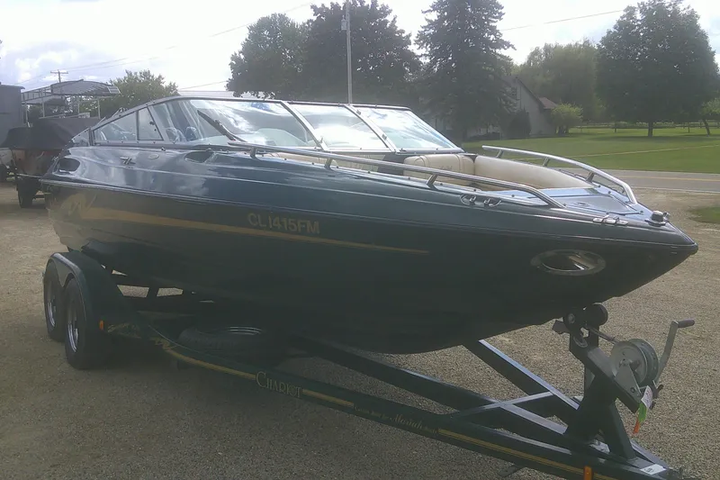 Slide: The Image of 1997 Mariah Z 210 Shabah boat on trailer, parked outdoors. - 21