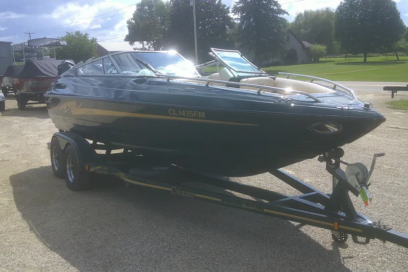 Slide: The Image of 1997 Mariah Z 210 Shabah boat on trailer, parked outdoors on a sunny day. - 3