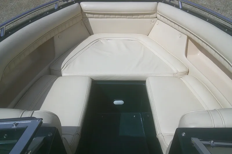 Slide: The Image of Interior seating of a 1997 Mariah Z 210 Shabah boat with cream upholstery. - 5
