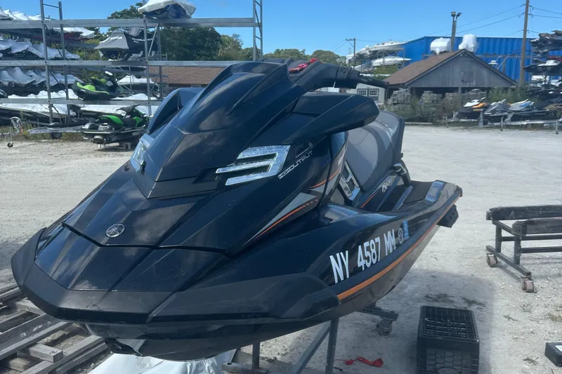 The Image of 2016 Yamaha WaveRunner FX HO jet ski parked outdoors on a sunny day. - 1