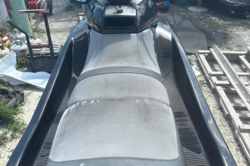Slide: The Image of 2016 Yamaha WaveRunner FX HO jet ski with gray seating, parked outdoors. - 10