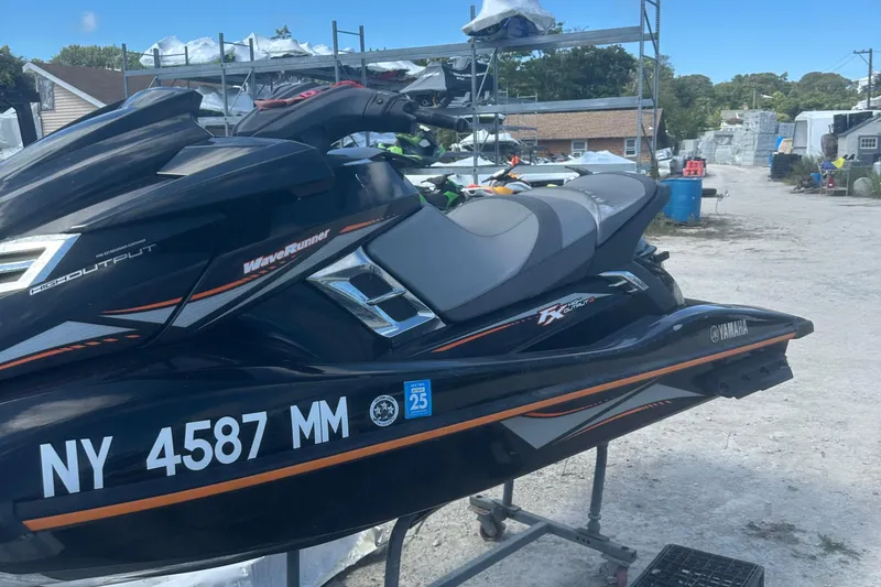 Slide: The Image of 2016 Yamaha WaveRunner FX HO jet ski on a stand outdoors. - 7