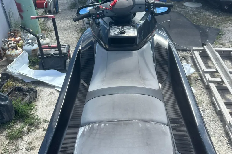 Slide: The Image of 2016 Yamaha WaveRunner FX HO jet ski in a storage area, surrounded by equipment. - 9