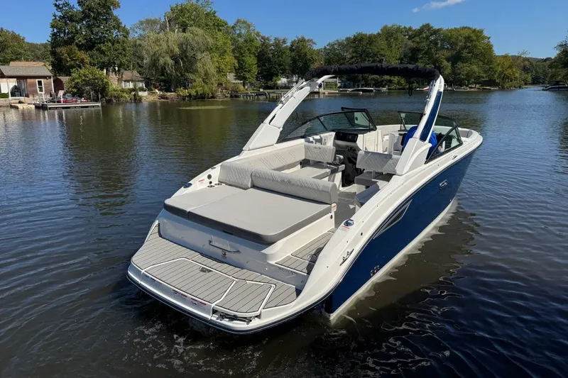 Slide: The Image of 2026 Sea Ray SDX 270 boat on calm water. - 1