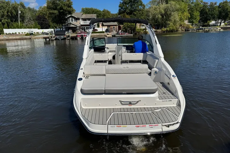 Slide: The Image of Sea Ray SDX 270 boat on calm water, 2026 model. - 4