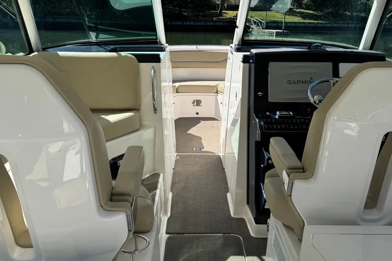 Slide: The Image of Interior of 2016 Pursuit DC 325 Dual Console boat with Garmin navigation system. - 10