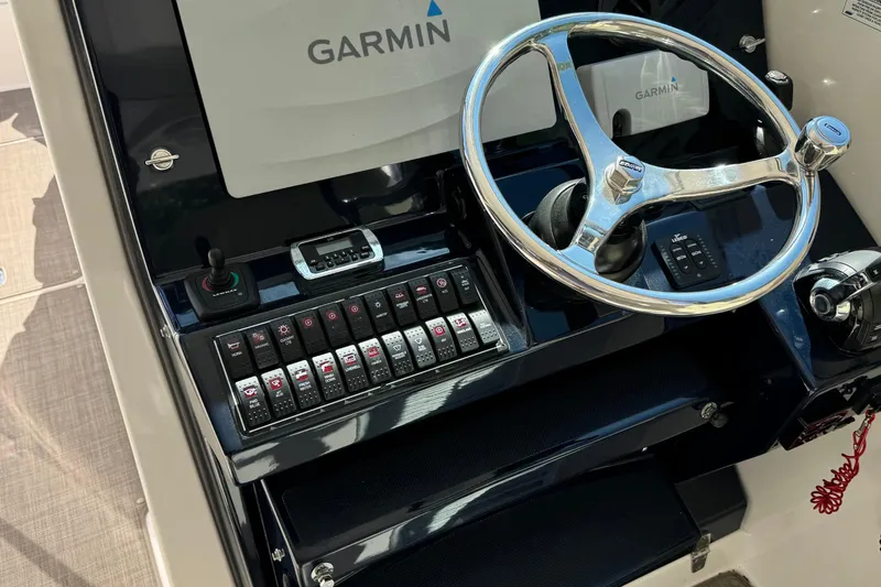 Slide: The Image of Control panel of 2016 Pursuit DC 325 Dual Console with Garmin navigation system. - 20