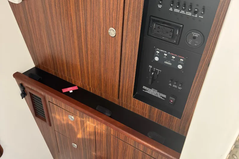 Slide: The Image of Control panel of 2016 Pursuit DC 325 Dual Console boat with wood finish. - 21