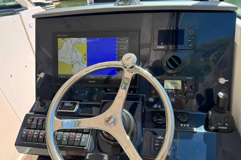 Slide: The Image of 2016 Pursuit DC 325 Dual Console helm with Garmin navigation and Yamaha controls. - 22