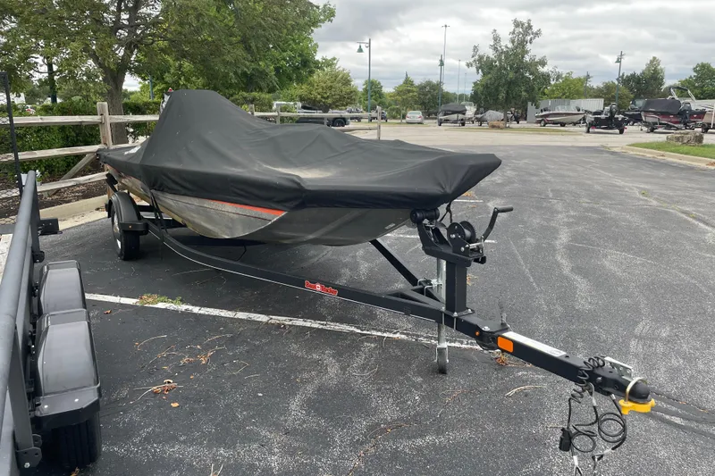 Slide: The Image of 2018 Tracker Bass Tracker 40th Anniversary Heritage Edition boat covered in parking lot. - 4