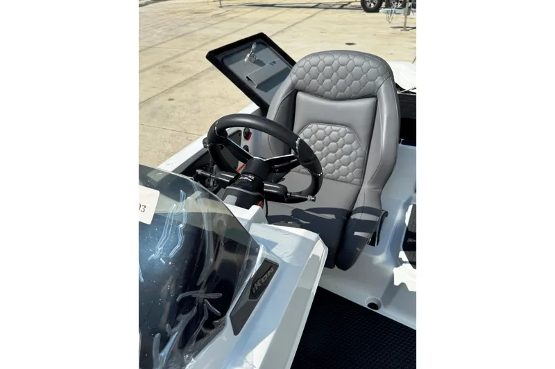 Slide: The Image of Steering area of 2026 iKon VLE20 boat with gray quilted seat and dashboard. - 12