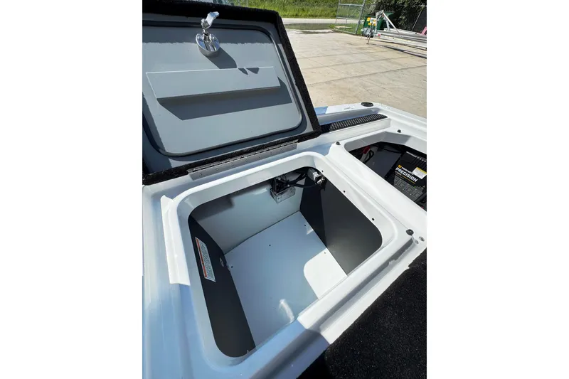 Slide: The Image of Open storage compartment in 2026 iKon VLE20 boat, showcasing interior space and design. - 14