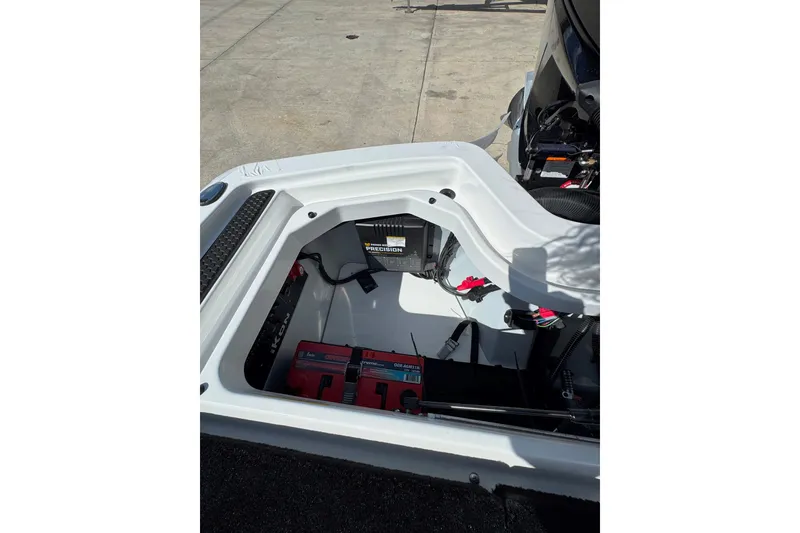 Slide: The Image of Open battery compartment of 2026 iKon VLE20 boat, showcasing internal components and wiring. - 15