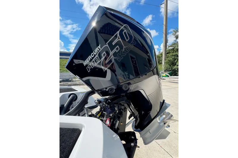 Slide: The Image of Mercury Pro 250 outboard motor on iKon VLE20, 2026 model, under clear blue sky. - 20