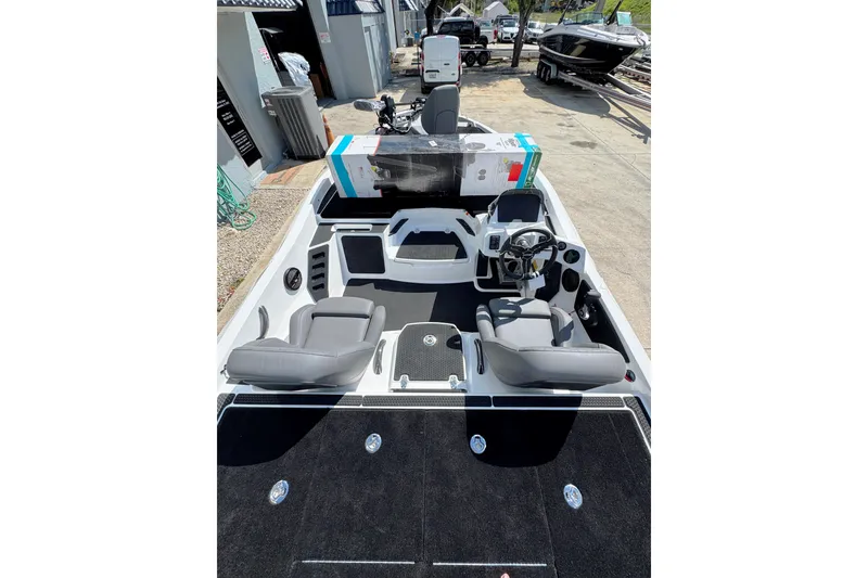 Slide: The Image of 2026 iKon VLE20 boat interior with modern seating and steering console. - 4