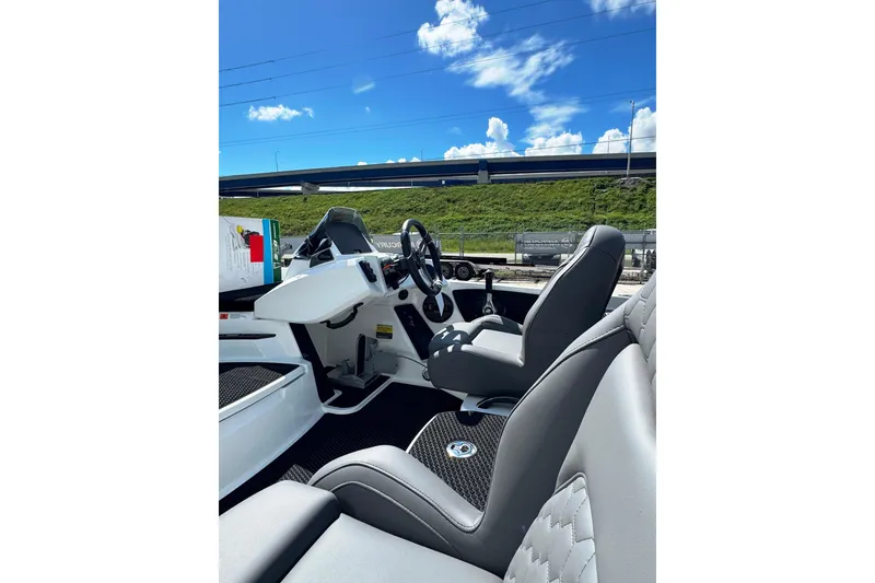 Slide: The Image of Interior of 2026 iKon VLE20 boat with modern seating and steering wheel. - 7