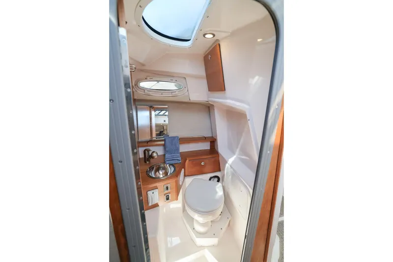 Slide: The Image of 2026 Cutwater C-248 Coupe bathroom interior with modern fixtures and natural lighting. - 16