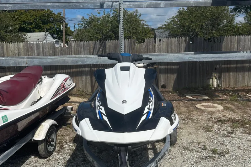 Slide: The Image of 2019 Yamaha WaveRunner VX Deluxe parked outdoors on gravel. - 2