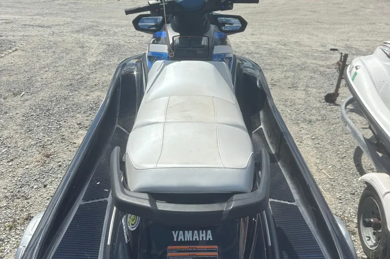 Slide: The Image of 2019 Yamaha WaveRunner VX Deluxe on gravel surface, rear view. - 9