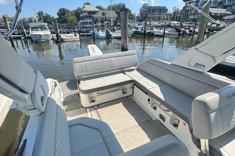 Slide: The Image of 2025 Sea Ray SDX 250 Outboard cockpit with modern steering and controls. - 10