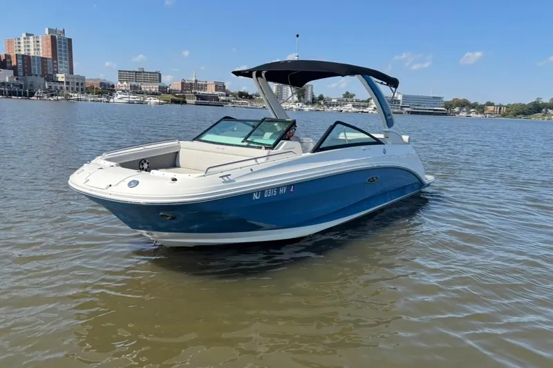 Slide: The Image of 2025 Sea Ray SDX 250 Outboard boat interior with luxurious seating and modern design. - 6