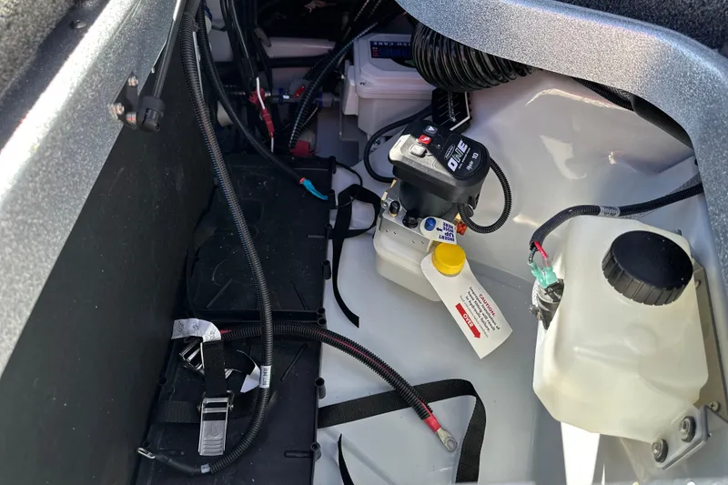 Slide: The Image of Interior view of 2026 iKon LXE21 boat showing battery and wiring components. - 11