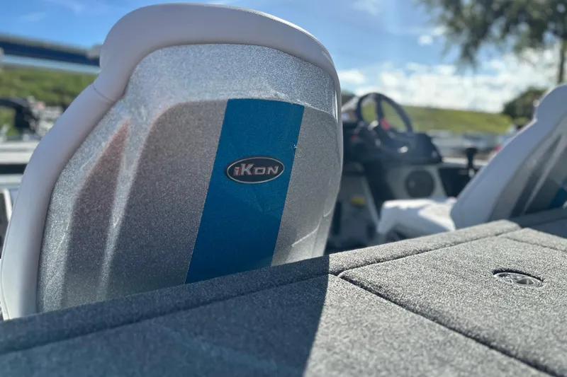 Slide: The Image of 2026 iKon LXE21 boat interior with logo, featuring sleek seating and modern design. - 12