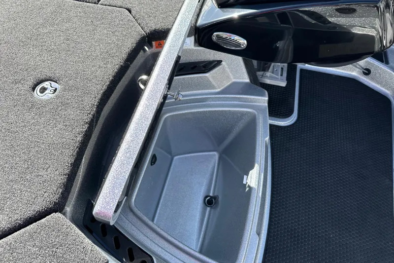 Slide: The Image of Open storage compartment on 2026 iKon LXE21 boat, featuring sleek design and durable materials. - 14