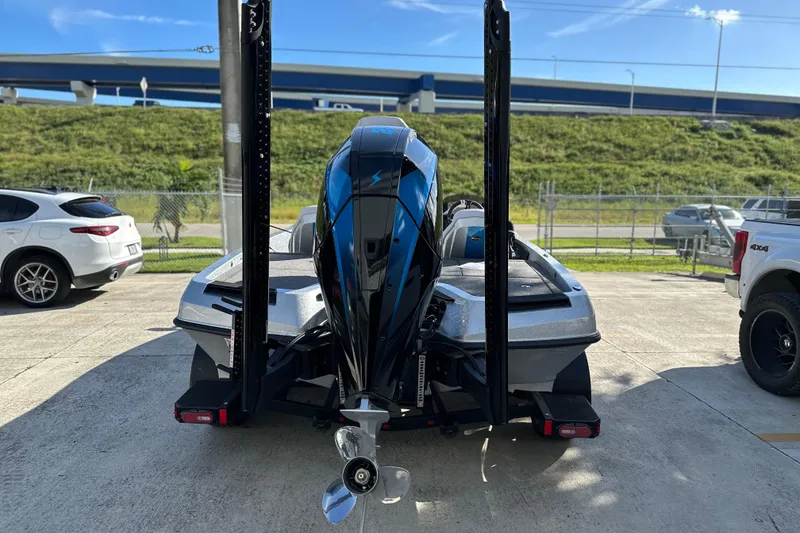 Slide: The Image of Rear view of a 2026 iKon LXE21 boat with powerful outboard motor. - 16