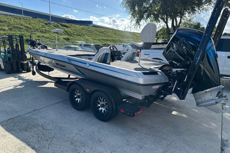 Slide: The Image of 2026 iKon LXE21 boat on trailer, parked outdoors under clear sky. - 3
