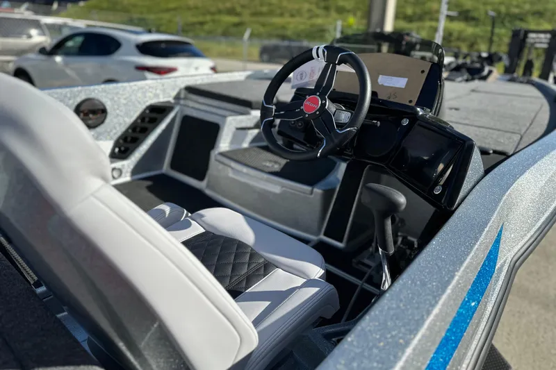 Slide: The Image of Interior of 2026 iKon LXE21 boat with modern steering and seating. - 6