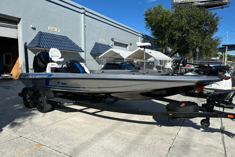 Slide: The Image of 2026 iKon LXE21 boat on trailer outside industrial building. - 7