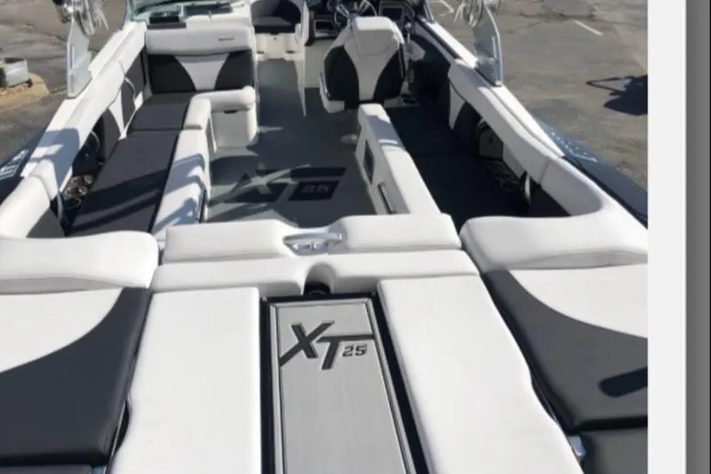 Slide: The Image of 2019 MasterCraft XT25 boat interior with spacious seating and modern design. - 8