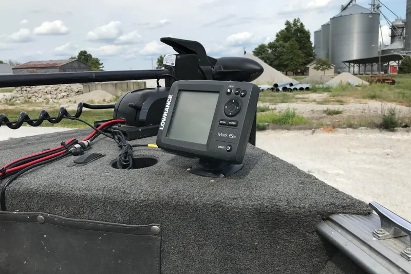 Slide: The Image of Lowrance fish finder on 2014 Lund 1650 Rebel XL SS boat, outdoor setting. - 16