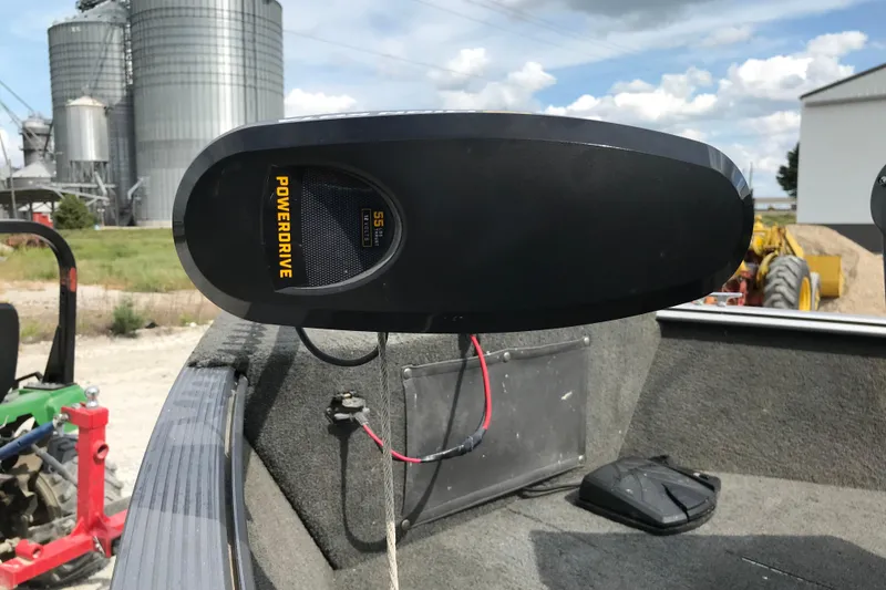 Slide: The Image of 2014 Lund 1650 Rebel XL SS boat with PowerDrive motor, farm silos in background. - 9