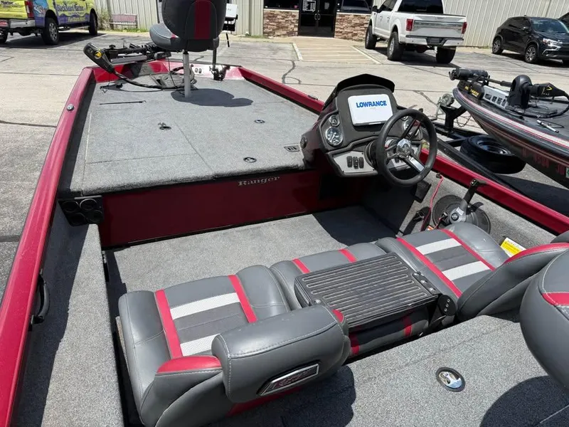 Slide: The Image of 2023 Ranger RT 188 boat interior with steering wheel and seating, featuring Lowrance electronics. - 8