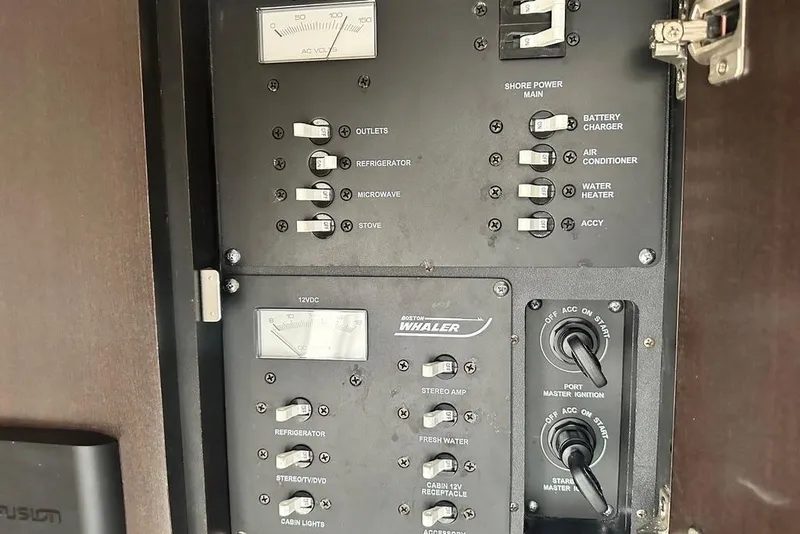 Slide: The Image of Electrical control panel of a 2009 Boston Whaler 285 Conquest boat. - 13