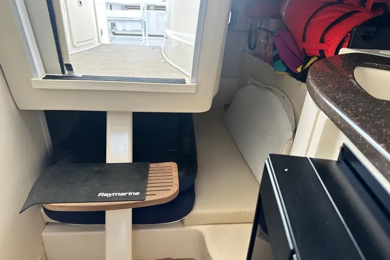 Slide: The Image of Interior view of 2009 Boston Whaler 285 Conquest cabin with Raymarine equipment. - 14