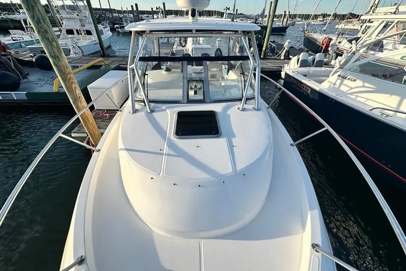 Slide: The Image of 2009 Boston Whaler 285 Conquest docked at marina, top view. - 15