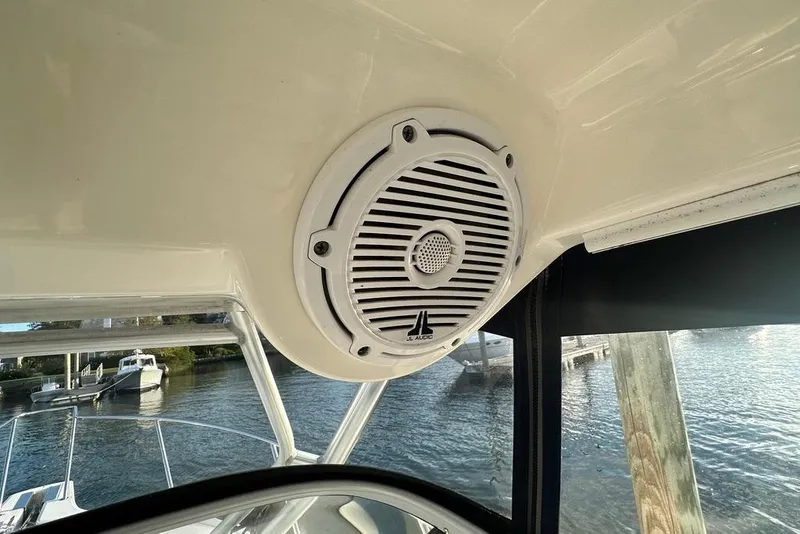 Slide: The Image of Speaker on 2009 Boston Whaler 285 Conquest boat, overlooking water and dock. - 7